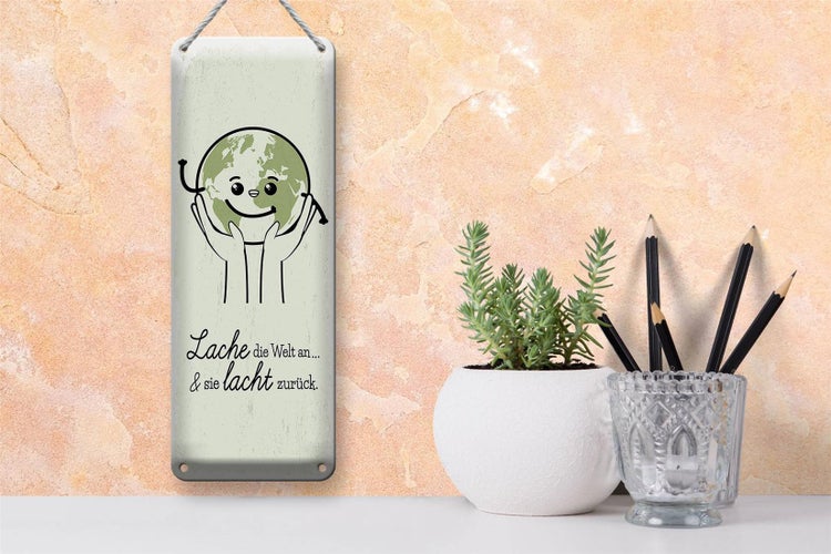 Blechschild Spruch Lache die Welt an sie lacht zurück 10x27cm