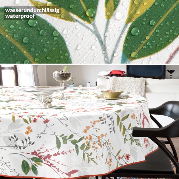 Wasserabweisende runde Tischdecke mit Blumenmuster in einem hellen, modern eingerichteten Wohnzimmer.