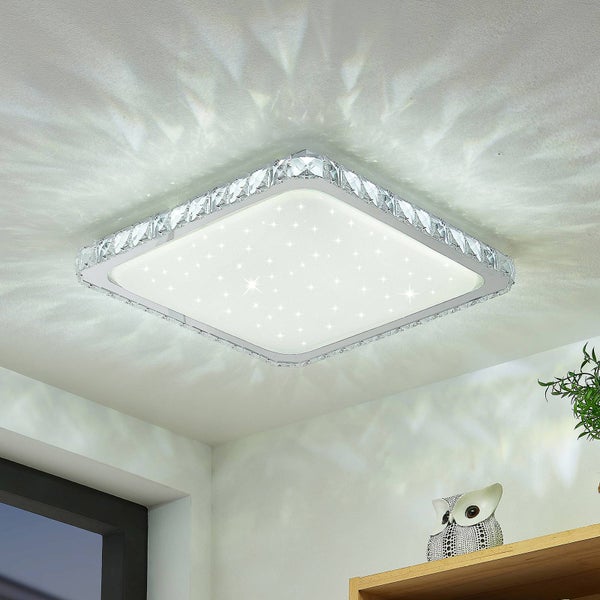 Quadratische LED-Deckenleuchte mit Sternenhimmel-Effekt und Kristallrand, montiert an einer Decke mit Lichtreflexionen.
