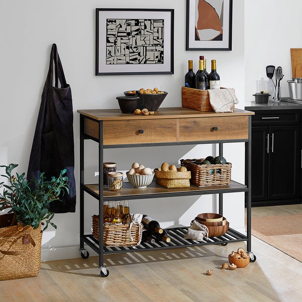 Küchenwagen mit zwei Schubladen, Regalen und Rollen, dekoriert mit Lebensmitteln und Küchenutensilien.