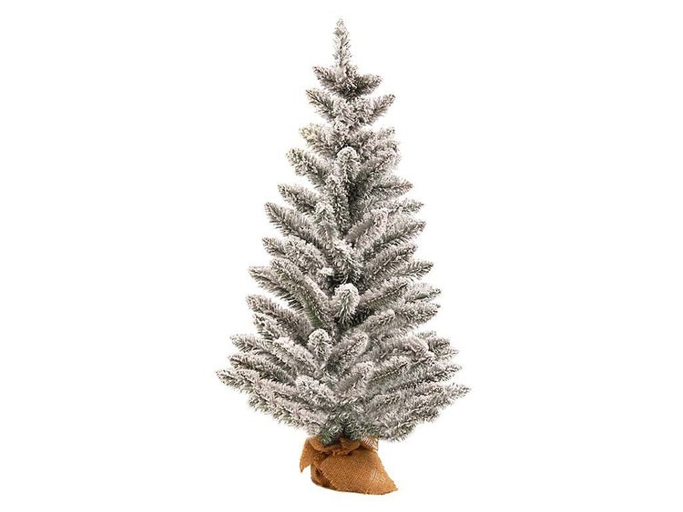 Künstlicher, beschneiter Weihnachtsbaum im Jutesack als Tischdekoration.