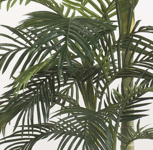 Künstlicher Blauregen Zweig mit weißen Blüten und grünen Blättern.