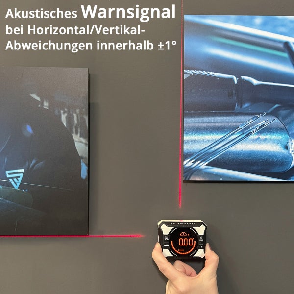 Person benutzt digitale Wasserwaage von Stahlwerk, um Bilder an einer Wand auszurichten