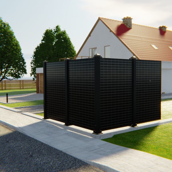 Gartenszene mit modernem Sichtschutzzaun vor einem Wohnhaus