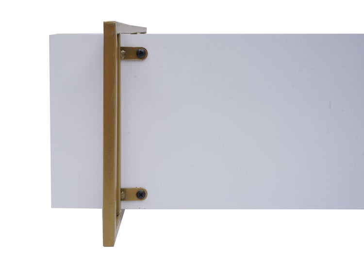 Detailaufnahme eines weißen Möbelauszugs mit goldenem Metallrahmen.