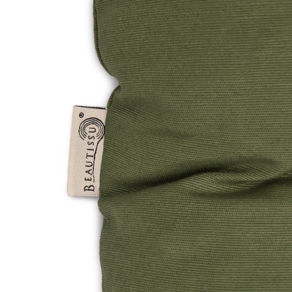 Detailaufnahme eines grünen Textilstoffes mit Beautissu Logo.