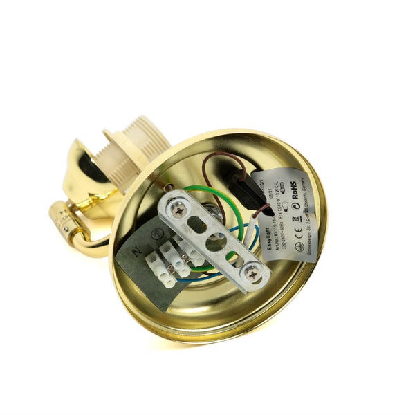 Innenansicht einer goldenen Lampenfassung mit Verkabelung