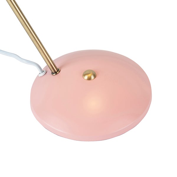 Detailaufnahme einer Tischleuchte mit rundem Fuß und Messingdetails