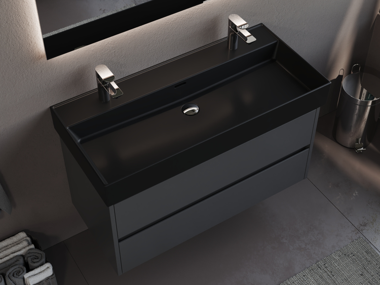 Waschtisch mit Unterschrank und zwei Armaturen im Badezimmer