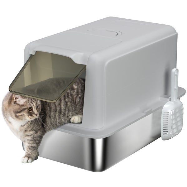 Katze in einer geschlossenen Katzentoilette mit Schwingtür und Schaufel