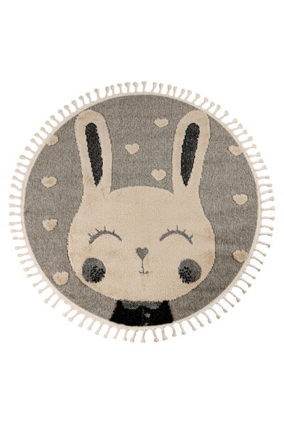 Runder Kinderteppich mit Hasenmotiv und Quastenrand für das Kinderzimmer.