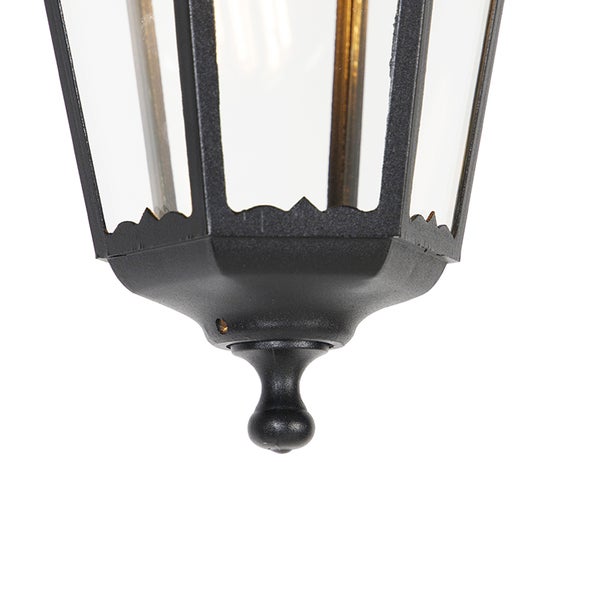 Nahaufnahme der Unterseite einer schwarzen Außenlaterne mit Glaseinsätzen und dekorativem Abschluss.