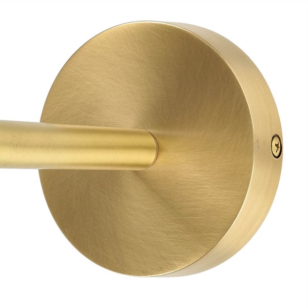 Detailaufnahme der Basis einer goldenen Stehleuchte.