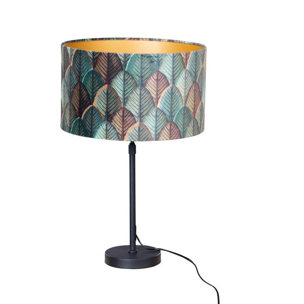 Tischleuchte mit Blattmuster auf Lampenschirm und schwarzem Lampenfuss
