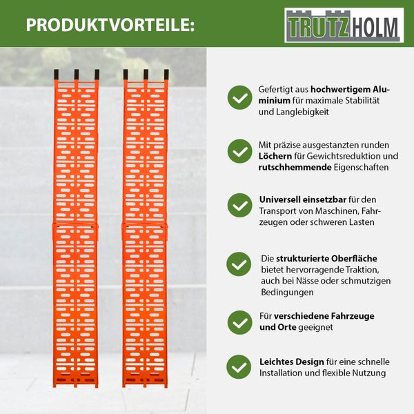 Zwei orangefarbene Aluminium Auffahrrampen mit Aussparungen und TrutzHolm Logo