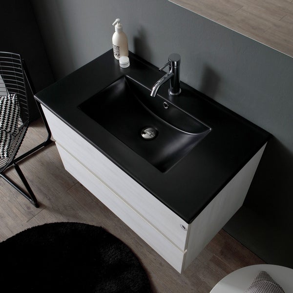 Waschtischkombination mit schwarzem Waschbecken und hellem Unterschrank im Badezimmer.