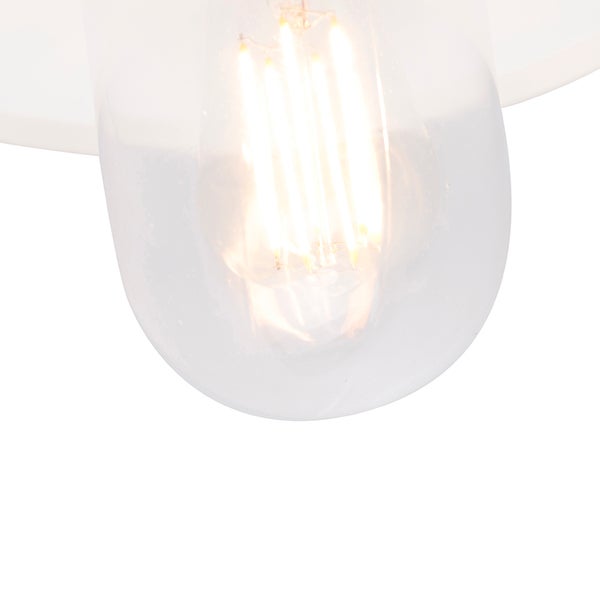Nahaufnahme einer Leuchte mit einem leuchtenden LED-Filament-Leuchtmittel.