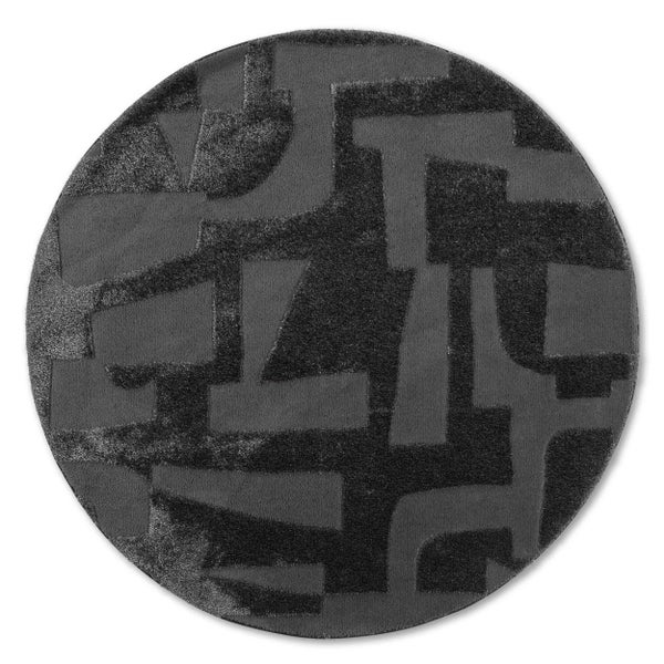 Runder Teppich mit abstraktem geometrischem Muster in Anthrazit und Schwarz.