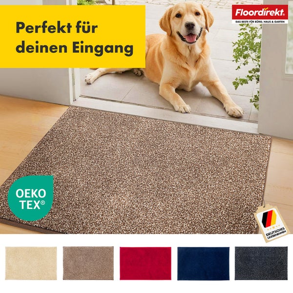 Fußmatte im Eingangsbereich mit Labrador und dem FloorDirekt Logo. Verschiedene Farboptionen und das OEKO-TEX Siegel sind sichtbar.