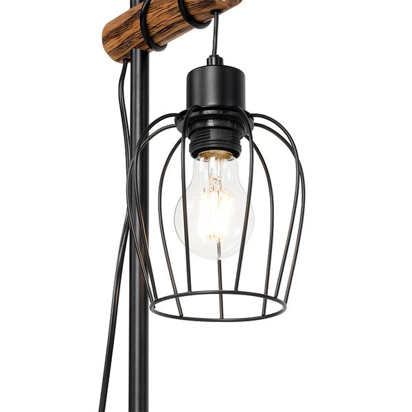 Detailaufnahme einer Stehlampe mit Metallkäfig und Holzelement.