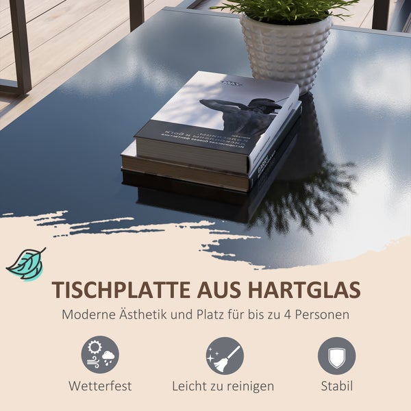 Tischplatte aus Hartglas mit Buch und Pflanze