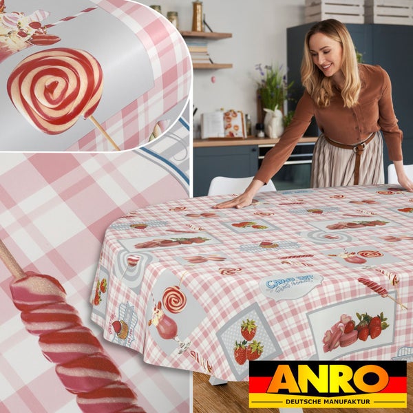 Ovale Wachstischdecke mit rosa-weißem Karomuster und Süßigkeiten-Motiven in einer hellen Küche, ANRO Logo.