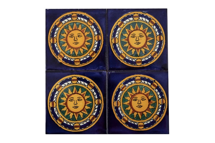 Vier blaue Fliesen mit Sonnendesign