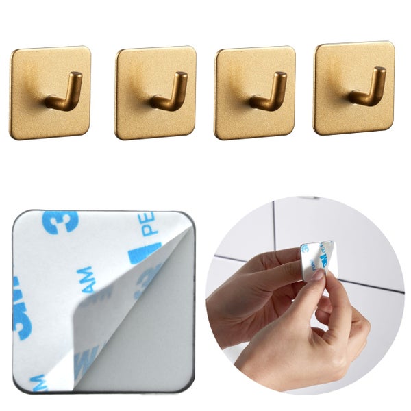 4 selbstklebende Haken in Goldoptik mit quadratischer Grundplatte und 3M Klebestreifen.