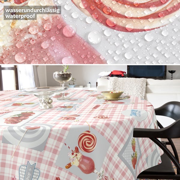 Rundes Tischtuch mit kariertem Muster, Süßigkeitenmotiven und wasserabweisender Oberfläche mit Wassertropfen.