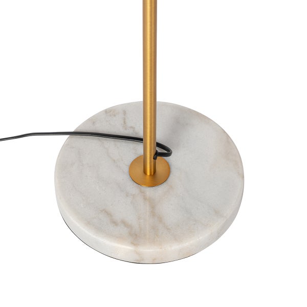 Detailansicht des Sockels einer Stehlampe aus Marmor mit einem goldenen Metallelement