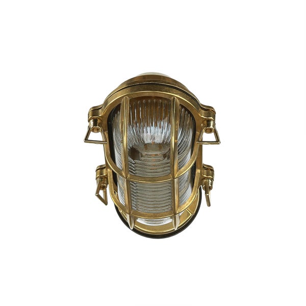 Goldene Schiffslampe mit Schutzgitter