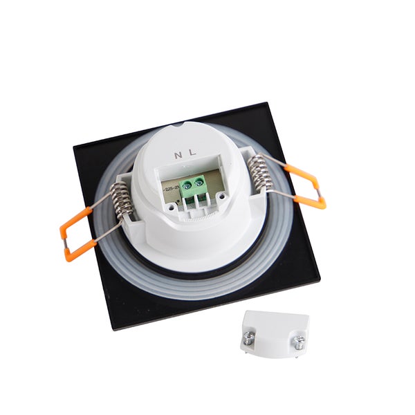 Quadratischer LED-Einbaustrahler in Schwarz und Weiß, Rückseite mit Montagefedern, Anschlussklemmen und Abdeckung.