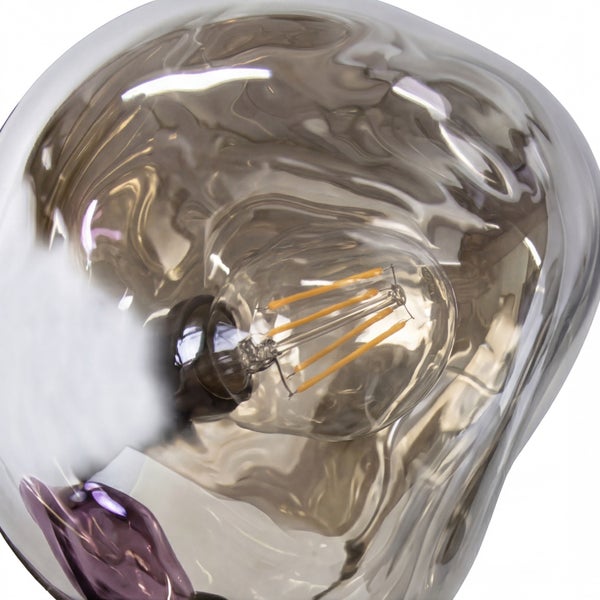 Pendelleuchte aus Glas mit unregelmäßiger, welliger Form und sichtbarem LED-Leuchtmittel.