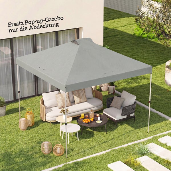 Graue Ersatzabdeckung für einen Pop-up-Pavillon über einer Gartenlounge mit Sofa und Sesseln auf einer Rasenfläche.