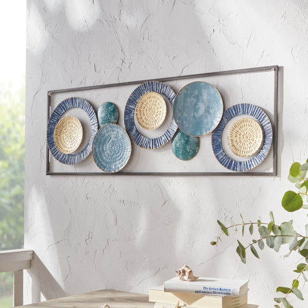 Dekorative Wandkunst mit Kreismotiven in einem rechteckigen Rahmen.