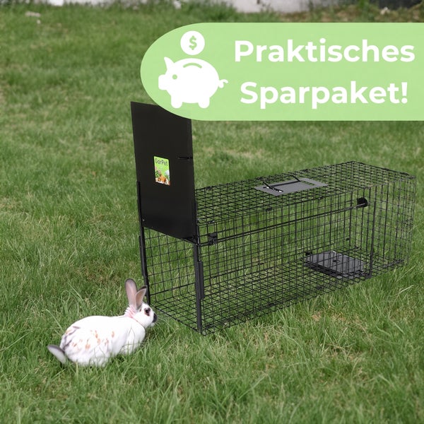 Lebendfalle aus Drahtgitter mit Kaninchen auf einer Wiese