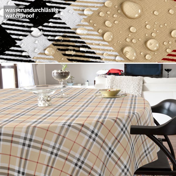 Wasserundurchlässige Tischdecke mit Karomuster auf einem runden Tisch. Detailansicht der wasserabweisenden Oberfläche mit Wassertropfen.