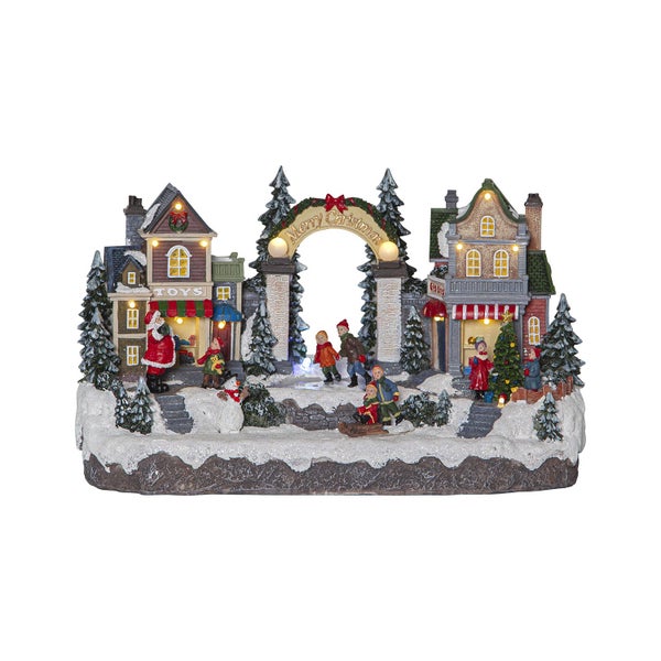 Dekoratives Weihnachtsdorf mit Häusern, Figuren und Beleuchtung für eine festliche Atmosphäre