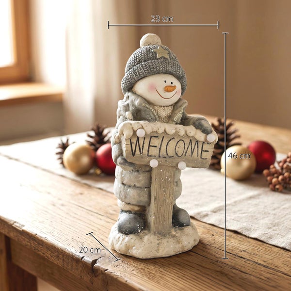 Dekorative Schneemannfigur mit Willkommensschild, Material Kunststein, Höhe 46 Zentimeter, Breite 23 Zentimeter, Tiefe 20 Zentimeter.
