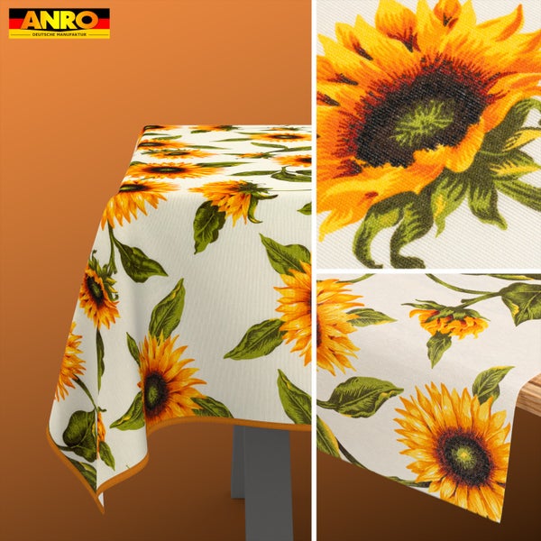 ANRO Logo. Tischdecke mit Sonnenblumenmuster und grünen Blättern auf hellem, strukturiertem Stoff, inklusive Detailansicht des Drucks.