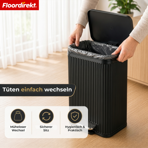 Floordirekt Logo. Eine Person setzt einen Müllbeutel in einen schwarzen, rechteckigen Treteimer mit Riffeldesign und offenem Deckel ein.