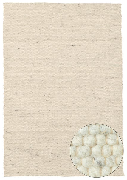 Beiger Teppich mit Detailaufnahme der Verarbeitung