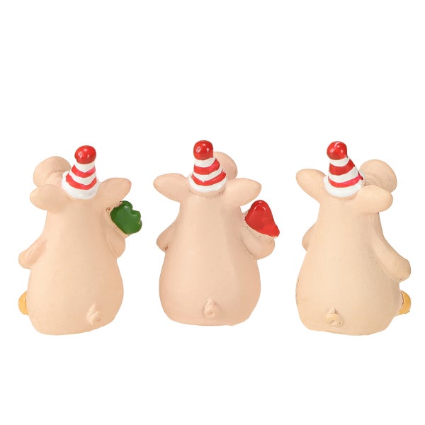 Drei Glücksschweinchen mit Partyhüten als Dekoration