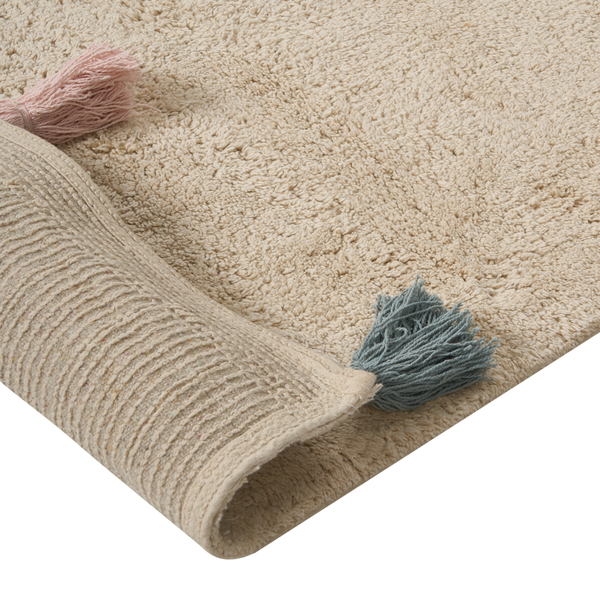 Strukturierter Badteppich aus Textil mit Quasten an den Ecken und gerippter Unterseite