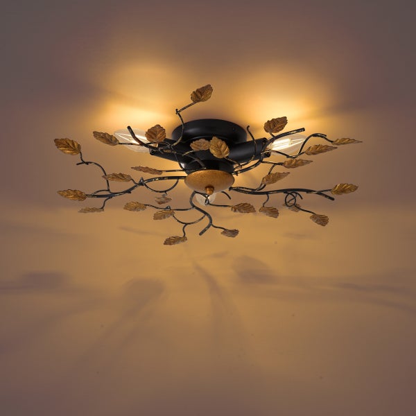 Dreiflammige Deckenleuchte im floralen Design mit schwarzen Metallästen und goldfarbenen Blättern.