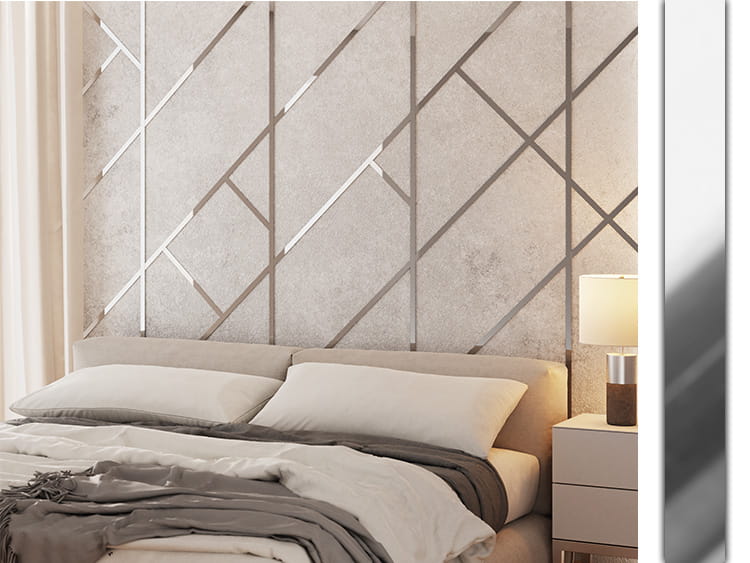 Schlafzimmer mit Bett, Nachttischlampe und Wandpaneelen im geometrischen Design