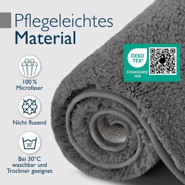 Aufgerollter Bademattenvorleger aus pflegeleichter Mikrofaser mit Oeko Tex Standard 100 Zertifizierung, nicht flusend und bei 30 Grad waschbar.