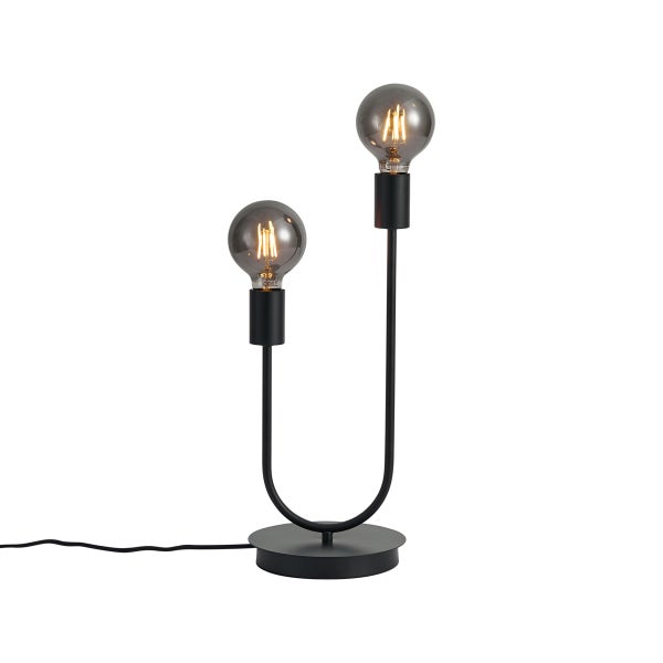 Moderne Tischleuchte aus schwarzem Metall mit U-förmigem Gestell, zwei Fassungen und dekorativen Filament-Glühbirnen auf rundem Sockel.