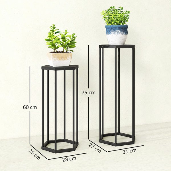 Zweiteiliges Set schwarze Blumenständer aus Metall in sechseckiger Form mit Maßen 60 mal 25 mal 28 cm und 75 mal 27 mal 31 cm.