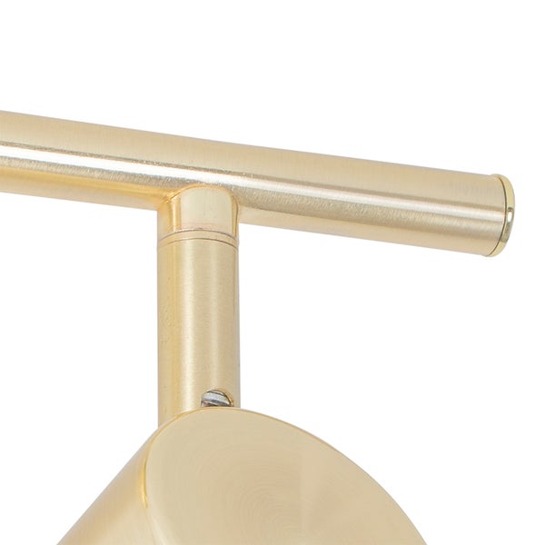 Detail einer goldenen Wandleuchte